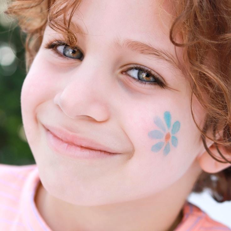 Kaveri Mehta, Lead Design Curator at Harbor Field Cabin, reviewing corporate floral arrangements